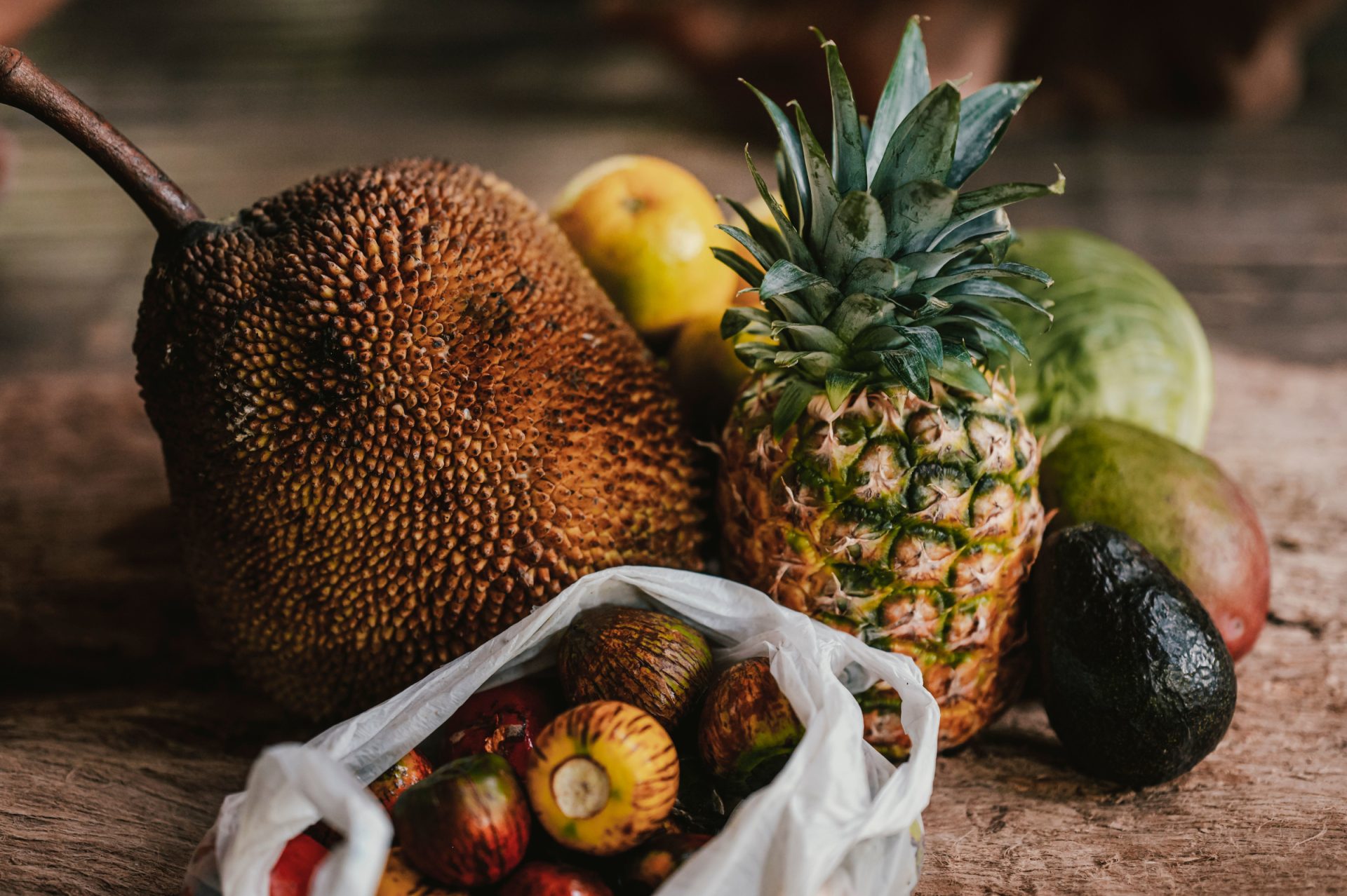 Assortment of healthy tropical fruits on a wooden table in Uvita, Costa Rica