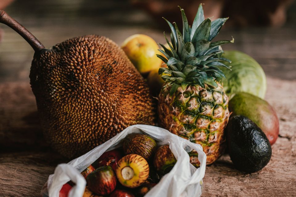 Assortment of healthy tropical fruits on a wooden table in uvita, costa rica